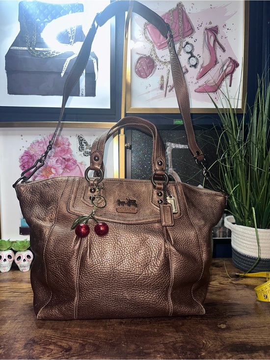 Coach Handbags - 2009Coach Madison Claire satchel is crafted from metallic bronze pebbled leather
